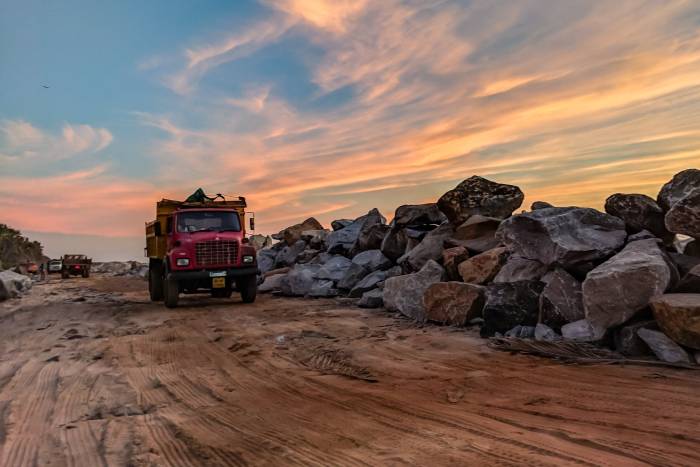 construction truck driving on sand